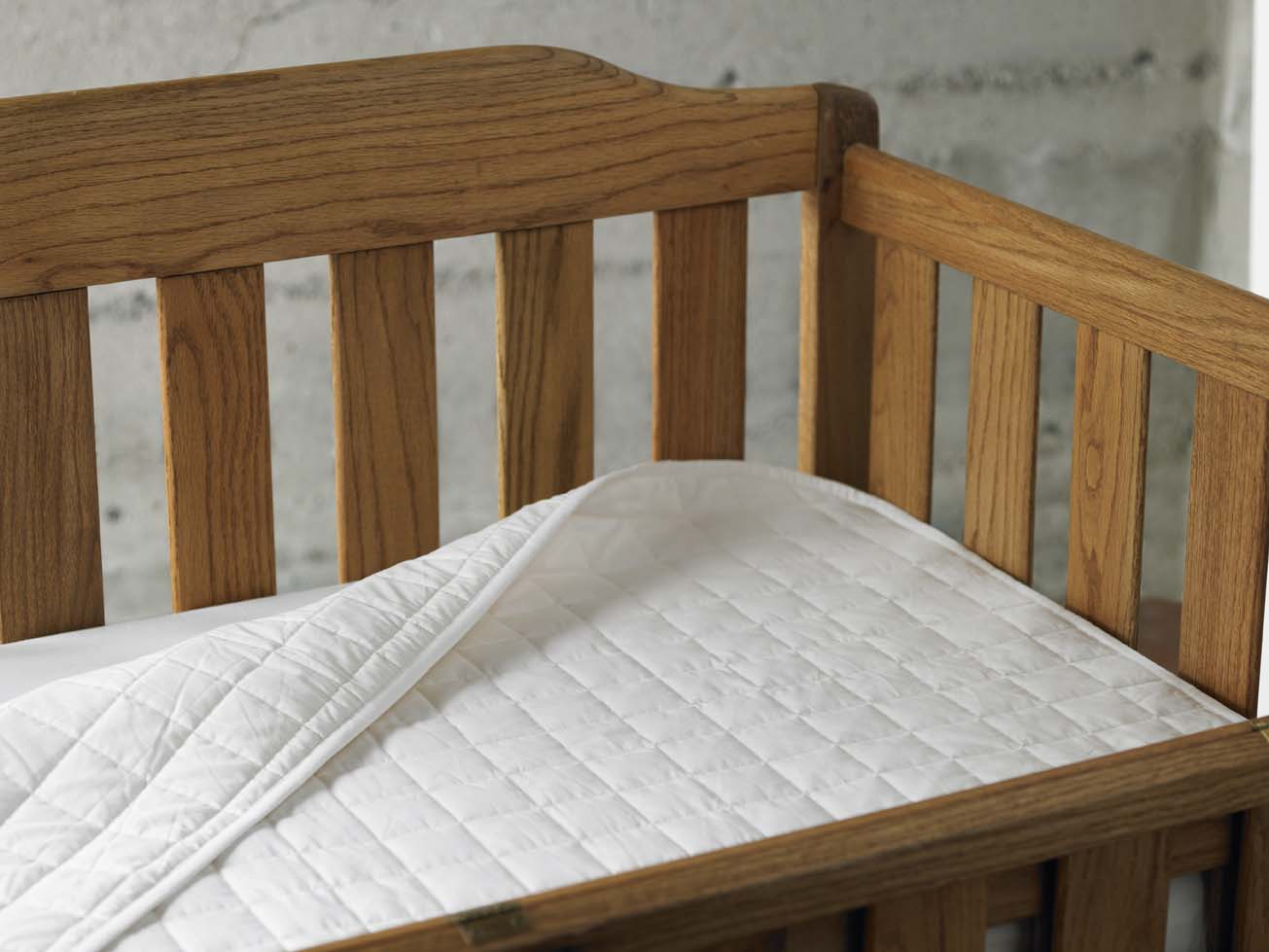 crib mattress pad too soft