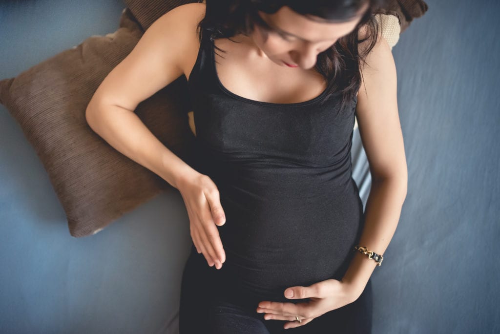 Expectant mom holding baby belly